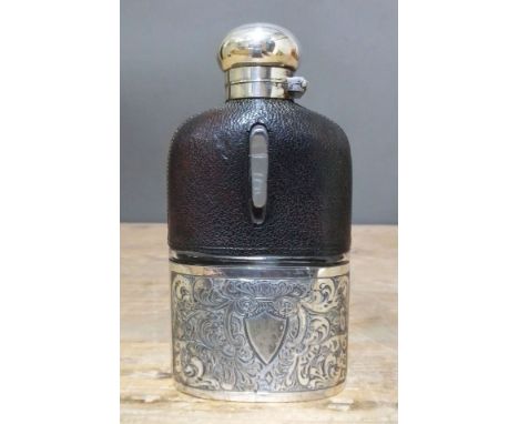 A silver plated and leather bound hip flask, bayonet fitting top, length 14cm.  Condition - good, general wear only, cork not