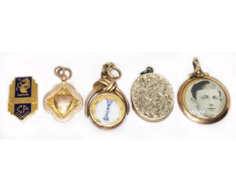 A mixed lot comprising a hallmarked 9ct gold 25 years service badge wt. 4.7g, a hallmarked 9ct gold fob wt. 5.5g, a hallmarke