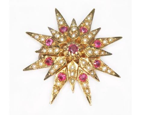 A ruby and split pearl star shaped separator, hallmarked 9ct gold, sponsor 'HJB', London 1977, diam. 33mm, gross wt. 9g.  