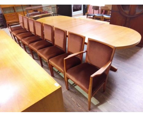 A Gordon Russell D end extending dining table with two extending leaves and eight chairs designed by Martin Hall circa 1972, 