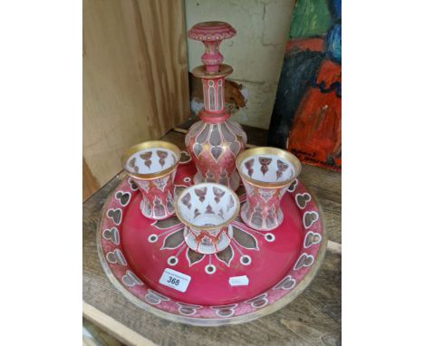 A Bohemian part drinking set, 19th century, comprised of a large circular tray, a decanter, two cups and a beaker.&nbsp;Condi