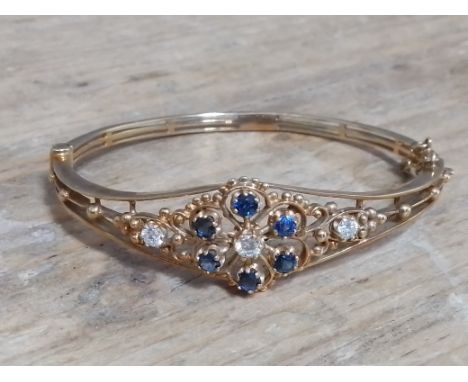 A diamond and sapphire bangle, 9ct gold, sponsor 'HBJ', London 1986, diam. 5.5cm, gross wt. 13g. 