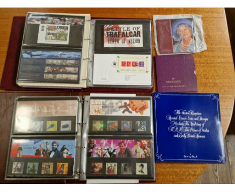 Two albums of assorted first day covers and presentation packs togehter with various commemorative coin packs. 