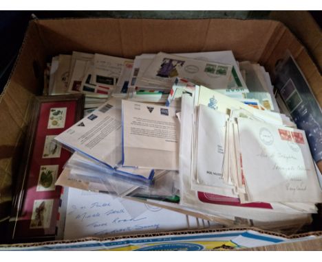 A box of assorted first day covers, also including airmail, postcards, cigarette cards mint stamps.