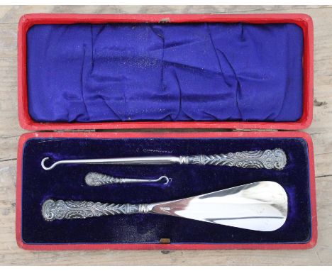 A cased hallmarked silver handle button hook and shoe horn set.  