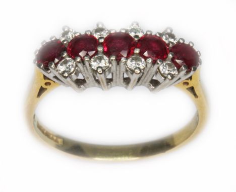 A ruby and diamond cluster ring, hallmarked 18ct gold, sponsor 'B&amp;S', Birmingham 1989, gross wt. 3.6g, size N/O.  