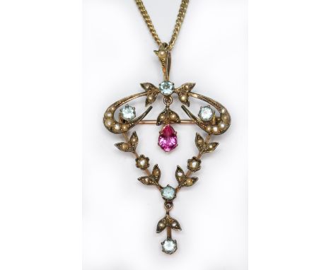 An Edwardian pendant set with a central pink sapphire/ruby surround by split pearls and blue paste, length 53mm, unmarked, on