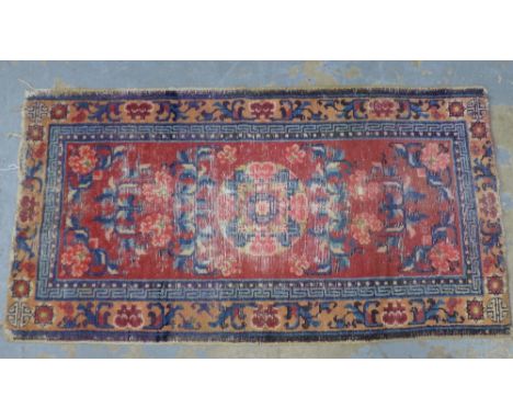 Tibetan wool runner, worn pink field with flowerheads and Greek key border 125 x 67cm 