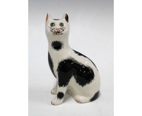 Griselda Hill Pottery Wemyss black and white cat, with painters initials RR, 11 x 17cm. 