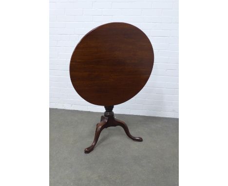 A mahogany tripod table, circular tilt-top, raised on triple splay supports with pad feet. 77 x 70cm. 