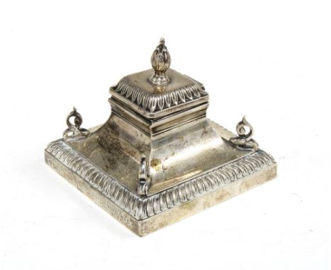 George V silver desk inkwell, with a hinged cover and leaf capped finial, square form base with a gadrooned edge, presentatio