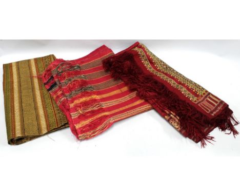 Three Indian textiles with silk threads and tassels, longest is approx 325cm x 88cm,  (3) (dark red runner with moth holes) 