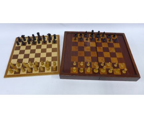 Two chess sets with folding chess boards, one with backgammon markings on the reverse, 48 x 38cm open 