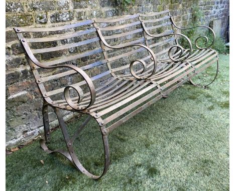 ESTATE GARDEN BENCH, 186cm W, early 20th century (circa 1900), wrought iron scrollwork, with three section seat. 