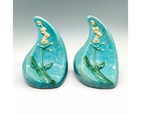 Beautiful azure blue coloration with floral and leaf design under light glaze on a teardrop shaped bookend. Roseville USA rai