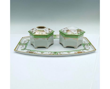A beautiful white set adorned with a light green border and gilt flowers. Includes a tray, hair receiver, and a covered powde