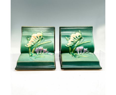 Light glaze over green coloration on bookends styled as books accented with flower on center pages in peach and lavender. Ros