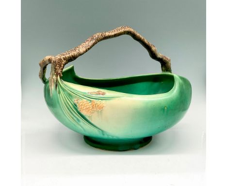 Light glaze over sage green colored base with brown branch handle, accented with raised pinecone design. Roseville impressed 