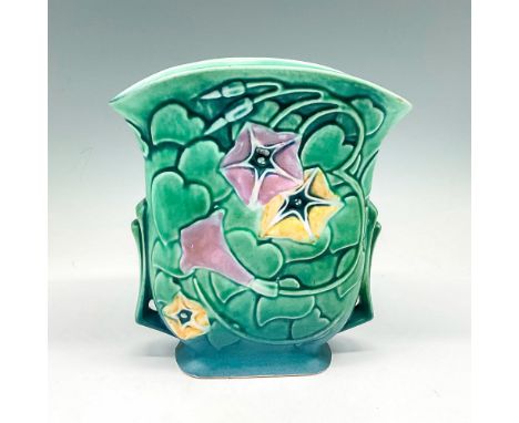 Matte finish over green coloration with blue base and mosaic floral design in lavender and yellow. Roseville Pottery sticker.