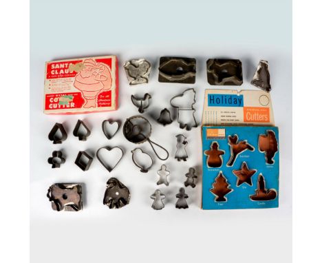 This vintage grouping of cookie cutters includes Christmas, animal, gingerbread people, playing card suits, and a donut cutte