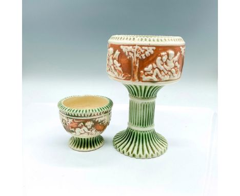 2 small vessels with green and creamed colored Corinthians and cherubs set against brown ground. Vase 1: 4.5"W x 7"H. Vase 2: