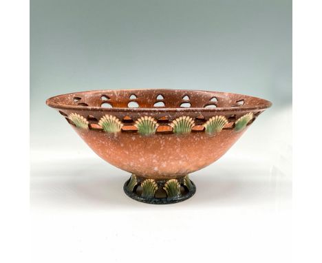 Unique oval footed bowl with light glaze over mottled brown coloration. Rim is pierced and designed with yellow stylized flow