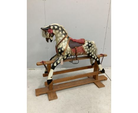 A dapple grey rocking horse, on beech safety frame, length 127cm, height 100cm. Condition - fair