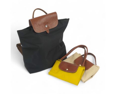 A Longchamps black rucksack, a shoulder bag and a briefcase bag Rucksack no damage; light signs of previous use only.  Yellow