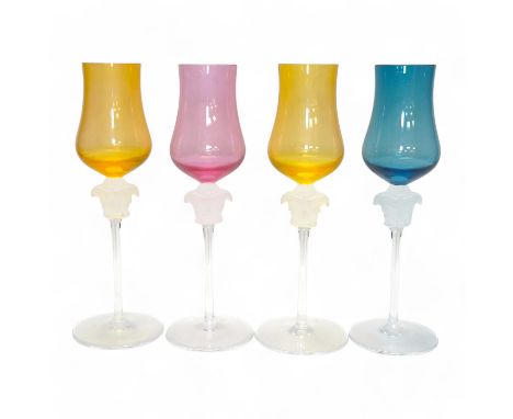 Four boxed Rosenthal for Versace Medusa head grappa glasses in various colours, 21.5cm high. Condition - good.