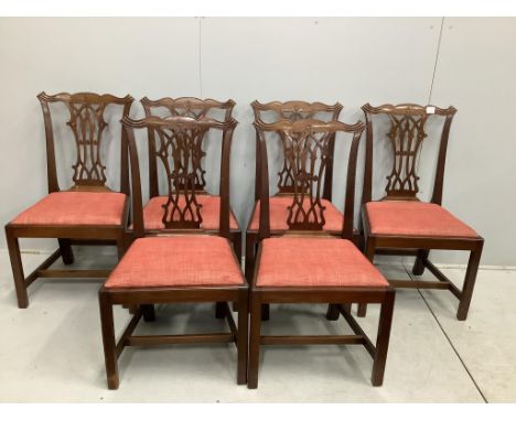 A set of six George III style mahogany Chippendale design dining chairs, with pierced splats, over drop-in seats and H stretc