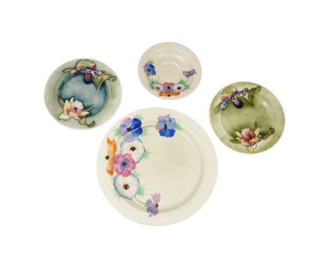 A pair of Moorcroft side plates and two plates Clarice Cliff plates. Condition - fair to good