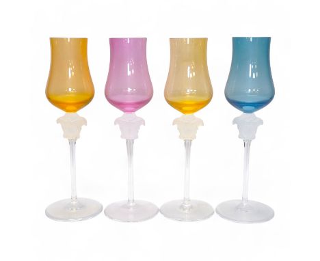 Four boxed Rosenthal for Versace Medusa head grappa glasses in various colours, 21.5cm high. Condition - good.