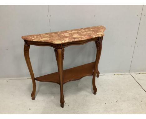 A Louis XVI style walnut serpentine marble topped two tier console table, width 100cm, depth 36cm, height 78cm. Condition - g