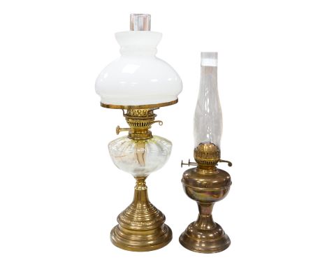 A late 19th century brass oil lamp with painted bowl and opaque shade together with a later oil lamp, largest 59cm high. Cond