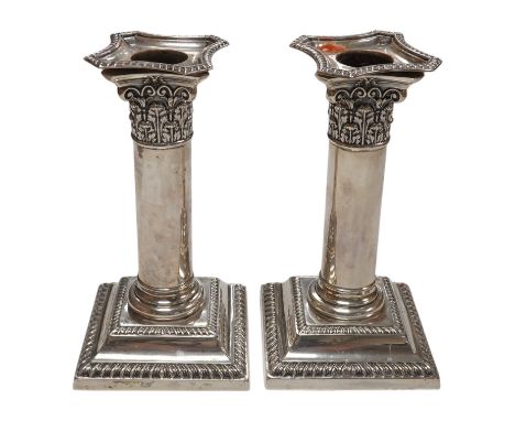 A pair of Edwardian silver dwarf candlesticks, by William Hutton &amp; Sons, London, 1905, 14cm, weighted. Condition - fair
