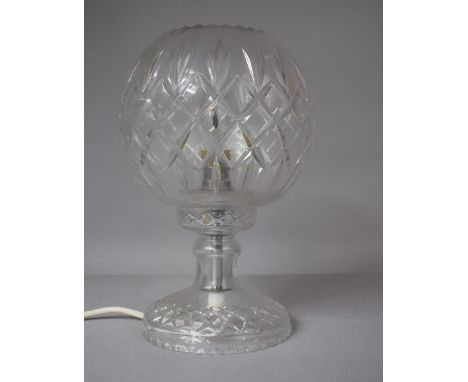 A Crystal Table lamp with Fluted and Diamond Cut Shade Raised on a Waisted Column with Circular Domed Base 