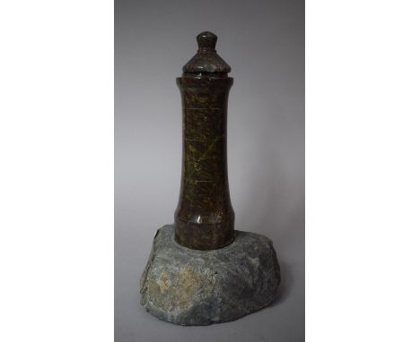 A Serpentine Marble Lighthouse Candlestick Set on Rock Base with Unrelated Lid, 30cms High 