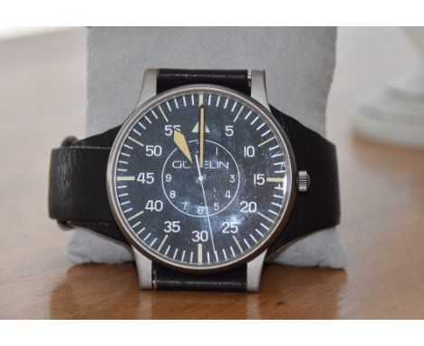 Vintage Armbanduhr GÜBELIN, Fliegeruhr / Sky Watch, Schweiz 1980er Jahre.Schwarzes Ziffernblatt mit Indizes, volle Stunden fl
