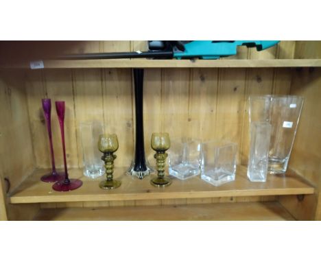 SHELF OF GLASS VASES