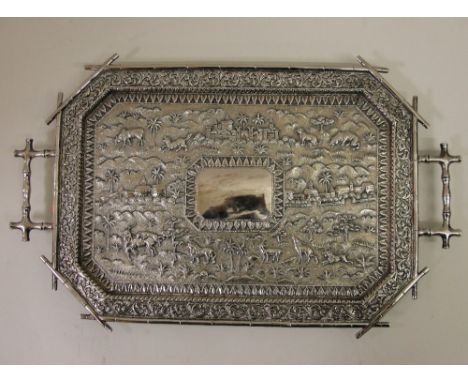 A 19th Century Anglo-Indian Silver Octagonal Twin-Handled Tray:
with stylised bamboo handles and edging with embossed jungle 