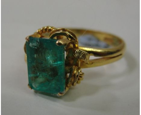 A Chinese 22 carat gold and emerald set ring