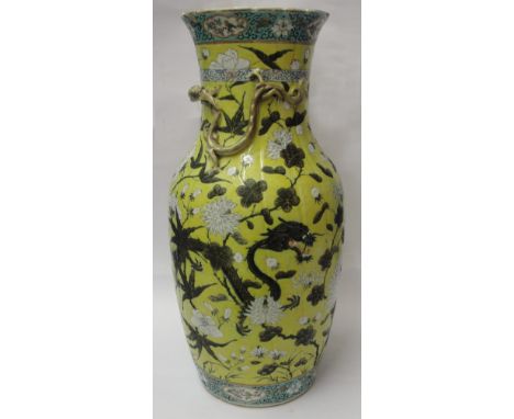 A Large Chinese Famille Jaune Vase:
finely decorated with two sinuous dragons amidst flowering peony and chrysanthemum branch