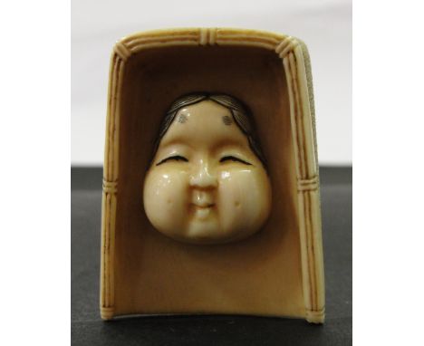 A Japanese Ivory Netsuke:
Meiji period
In the shape of Okame.
Artist's signature to the base
H 5 cm 