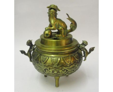 A Chinese Gilt Bronze Tripod Censer:
19th century
The bulbous body decorated with two pairs of confronting dragons chasing a 