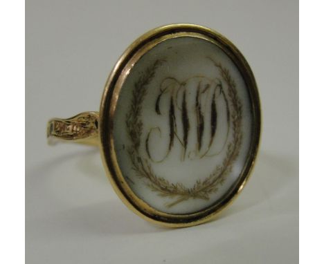 A Georgian mourning ring:
Circa 1771, the outer ring engraved "J W D OB 3 AUG 1771" with letters JW within laurels engraved o