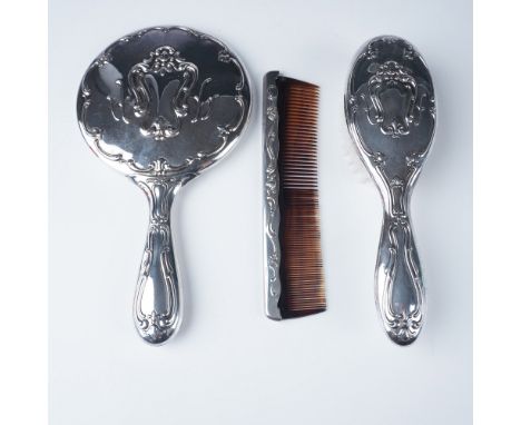 Elegant 3 piece Gorham electroplated vanity set featuring a hand-held mirror, brush, and comb. Each piece is adorned with int
