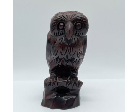 This intricately hand-carved wooden owl figurine showcases remarkable craftsmanship. The owl is perched on a naturalistic bas