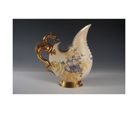 Elegant Robert Hanke porcelain pitcher featuring a dramatic dragon-form handle with rich gilt accents. The body is adorned wi