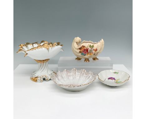 A collection of four porcelain shell-inspired bowls and compotes, each featuring intricate detailing and gilded accents. The 