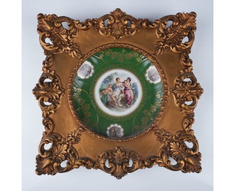 A decorative porcelain plate from Mitterteich Bavaria, Germany, featuring a vibrant green border with intricate gold vine pat
